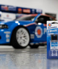Fast Setting Epoxy Resin Syringe For Quick Bonding, Single Use, All Purpose Formula on table in garage with race car in background