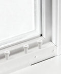 Ten Pack Window Screen Plunger Latch Pins With White Caps Solid Aluminum Five Thirty Two By One Point Five Inch No Sweat Snap Fit Replacement Bolts Slick Swap For Sliding Patio Doors And Screen Frames Truly Reliable Everyday Fix visible, white caps on aluminum pins in window frame.