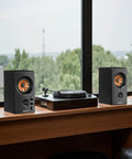 Active Bookshelf Speakers, 50W Bluetooth Home Studio Monitors With 3 Inch Woofer And 1 Inch Silk Dome Tweeter next to turntable