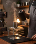 Upgrade Your Daily Drip With This Pro Level Stainless Steel Coffee Dripper Stand Reusable Pour Over Brewer No Paper Filters Required For Home Bars And Cafe Crews, steaming coffee being poured.