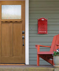 Vintage Rustic Wall Mounted Post Box Mailbox In Iron With Powder Coated Red Finish by door, outdoor setting