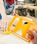 Hella Secure Kickback Blocker Featherboard Set With Extended Push Arms for Table Saws, showing yellow material and use in workshop.
