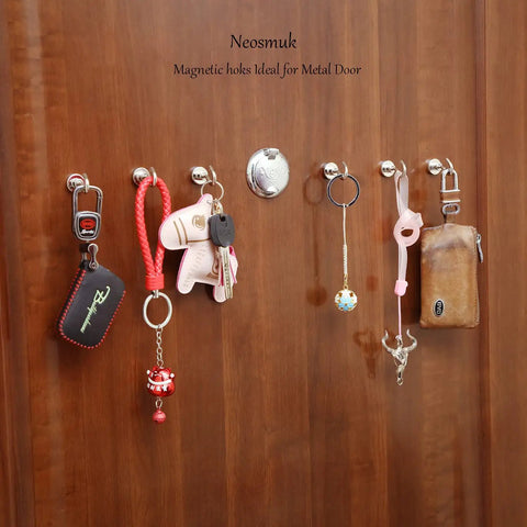 Heavy Duty Magnetic Hooks 30Lb Pack Of 4 For Fridge And Grill Hangers Extra Strong NdFeB Magnets In Silvery White on wooden door