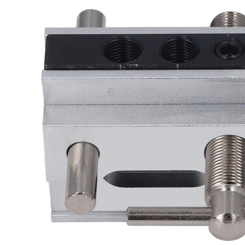 Close-up of Snappy Setup Adjustable Width Doweling Jig Kit showing clamp mechanism and guide holes for precision drilling.