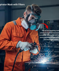 Worker wearing Pro Grade Full Face Respirator Mask With Replaceable Filters And 10 Spare Dust Pads For Painting Welding Sanding Dust And Construction Work Reusable Silicone Comfort Fit Industrial Grade Safety Gear while welding