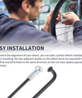 Person installing Universal Bike Spoke Set 13G 273mm Black Steel For Wheel Repair Includes 36 Spokes And 36 Nipples.