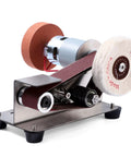 Super Slick Mini Belt Sander With Seven Adjustable Speed Settings For Knife Sharpening And Woodworking Or Light Metal Grinding No Fuss Compact Power Tool on a stainless steel base.