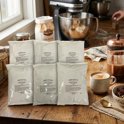 Creamy Instant Chai Latte Powder Mix For Hot Or Iced Drinks, Sweet Spiced Black Tea Latte With Milk And Honey packs on table