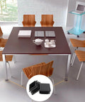30 Pack One And One Half Inch Square Plastic End Caps for Square Tubing Chair Legs Fence Black shown installed on table feet.