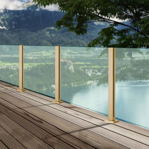 Super Sleek Heavy Duty Glass Railing Assembly With Stainless Steel Posts And Clamping Hardware For 10 To 12mm Panels on a wooden deck.