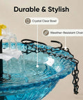 Close-up of Sun Powered Cascade Hanging Bird Bath Fountain For Gardens And Backyards in blue with crystal clear bowl and durable chains.
