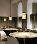 Modern Black Farmhouse Pendant Light With Glass Shade Industrial Style Hanging Light Fixture over a dining room setting