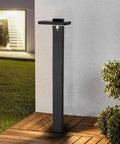 Solar Landscape Path Lights Outdoor Motion Sensor Garden LED Light Aluminum standing on patio edge at night