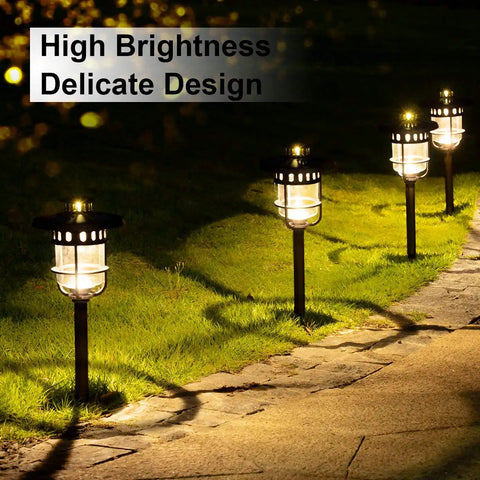 Six Pack Solar Path Lights Outdoor Glass And Bronze Finish with High Lumen Output Two Bright LEDs illuminate a garden path.