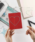 Person holding 3 Piece Die Cutting Pad And Shim Set For Standard Die Cutting Machines, Clear Polycarbonate Cutting Pads