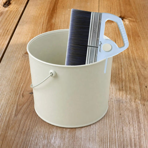 8 Inch Wide Flat Paint Brush For Large Areas Great For Acrylic Painting Wallpaper Paste Furniture Fence Stain And Gesso With Soft Poly Paddle And Ergonomic Handle Delivers Smooth Coverage And Faster Time Saving resting in a paint bucket on wooden surface