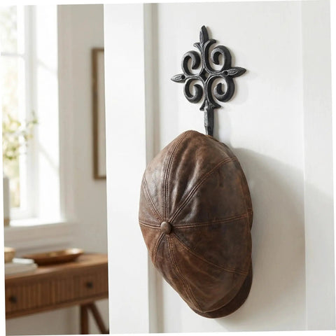 Rock Solid Cast Iron Wall Hook Knockout Vintage Charm For Entryway And Master Bedroom Bullet Proof Heavy Duty Towel And Coat Rack Dead Simple No Sweat Installation In Matte Black Finish With Screws Included Now holding a brown leather cap.