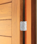 Heavy Duty 4 Inch Interior Door Hinges White Steel 3 Pack on wooden door frame, showcasing removable pin design.