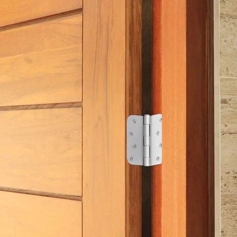 Heavy Duty 4 Inch Interior Door Hinges White Steel 3 Pack on wooden door frame, showcasing removable pin design.