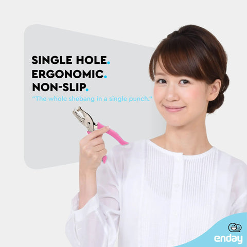 Woman holding Metal Single Hole Punch For Paper And Crafts With Soft Grip Handles, Pink Quarter Inch Hole Puncher, ideal for scrapbooking.