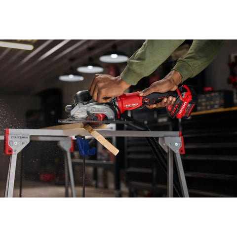 Heavy Duty 4.5 Inch Cordless Circular Saw With Brushless Motor Punching Up To 4500 Rpm cutting wood on a saw horse in a workshop.