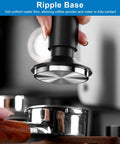 Holding 2-In-1 Espresso Tamper And Magnetic WDT Tool With 53mm Spring-Loaded Base over portafilter basket, anodized aluminum handle visible.