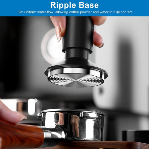 Holding 2-In-1 Espresso Tamper And Magnetic WDT Tool With 53mm Spring-Loaded Base over portafilter basket, anodized aluminum handle visible.