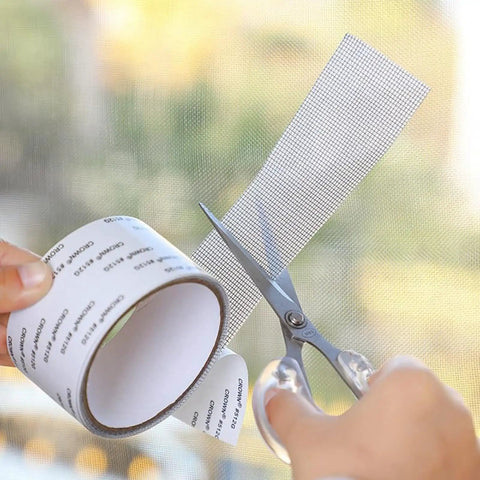 Hands cutting Heavy Duty Self Adhering Screen Repair Strip With Fiberglass Mesh For Windows And Doors Quick Fix For Holes Tears
