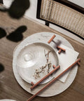 Six Pack 3 Inch Hole Center Antique Copper Zinc Alloy Cabinet Pulls on Tabletop with Dish Decor.