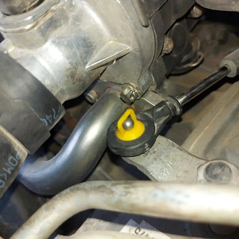 Close-up of engineered metal connection with bright yellow bushing from Shifter Cable Bushing Repair Kit Ten Piece Replacement For OEM 11612155 And 14104 Fits 2007 2008 Chevrolet Silverado And Buick Allure Restores Smooth Gear Shifts And Fixes Loose Shifters