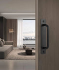 Black Barn Door Handles 4 Pack With 5 Inch Hole Center Aluminum Sliding Door Pulls installed on wooden door.
