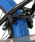 Close-up of 24 Inch Kids Freestyle BMX Bike For Beginners For Boys And Girls Aged 7 To 12, featuring blue tire and braking system.