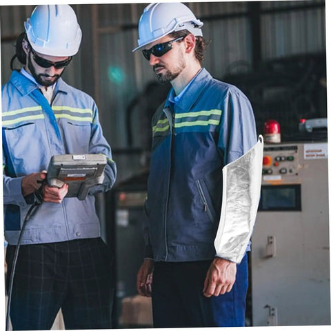 Heavy Duty Aluminum Foil High Heat Resistant Arm Sleeves Sweat Free Adjustable Breathable Guard Shields For Mechanics Hot Shop Work Lab Safety And Backyard Grills worn by a worker in a safety environment.