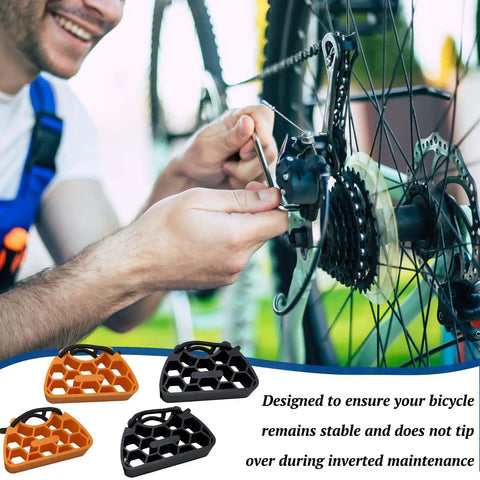 Cyclist using inverted bicycle handlebar stand with non slip straps for easy bike repairs, protective bar support, black and orange models.