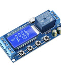 Time Delay Timer Relay With LCD Display For 5V 12V 24V Systems showing blue circuit board with buttons and connectors.