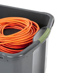 Heavy Duty 17.5 Gallon Plastic Storage Bin With Clear Lid And Full Length Through Wall Handles Gray Opaque Base Stacks Tight 70 Quart Tote For Blankets And Gear with orange cords inside.