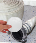 Concealed Fire Sprinkler Cover Plate And Ceiling Escutcheon Featuring A Snug Fit Slick Finish And No Sweat Install For Pristine Interior Rooms And Trustworthy Homeowner Security held above fire hose.