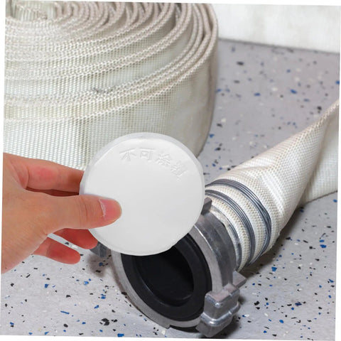 Concealed Fire Sprinkler Cover Plate And Ceiling Escutcheon Featuring A Snug Fit Slick Finish And No Sweat Install For Pristine Interior Rooms And Trustworthy Homeowner Security held above fire hose.