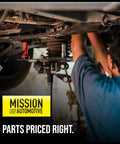Mechanic working on vehicle undercarriage, Mission Automotive sign, parts priced right