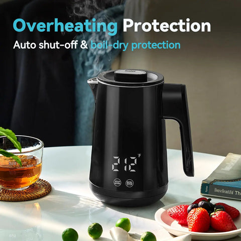 850Ml Small Electric Kettle With Temperature Control Your Quick Heat Buddy 800W Fast Boil Double Wall 304 Stainless Steel Five Temperature Presets Auto Shut Off Safe For Tea And Coffee Compact Kitchen Office Dorm Black on table next to fruit and tea cup.