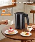 Fast Boil Electric Kettle 1.0L 1200W With 7 Temperature Settings 4 Hour Keep Warm Auto Shut Off Cool Touch Stainless Steel 120V Water Boiler For Home Office Black on a kitchen table with coffee cups and pastries.