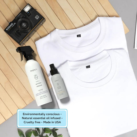 3-In-1 No Iron Wrinkle Release, Static Cling Remover, Odor Eliminator And Fabric Refresher Spray, Travel Size 3 oz next to white shirts.