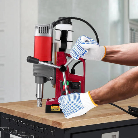 Precision Auto Portable Magnetic Drill Press 1550W Motor With 750 Rpm And One Point Five Seven Inch Boring Diameter being operated on wooden workbench.