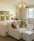Killer Contemporary Four Light Wall Sconce In Fresh Heirloom Brass Finish With Sophisticated Metropolitan Details For Top Notch Room Accent Lighting And Totally Sweet Candelabra Bulb Mounting in modern bedroom setting.