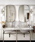 Bathroom with Colinet Traditional 24-Inch Towel Bar in Brushed Nickel, mounted near double vanity with mirrors.