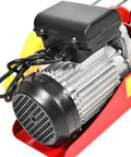 Close-up of a Built Tough 1500 Lb Overhead Electric Hoist Lift Crane for Garage Engine Work showing motor and red housing.