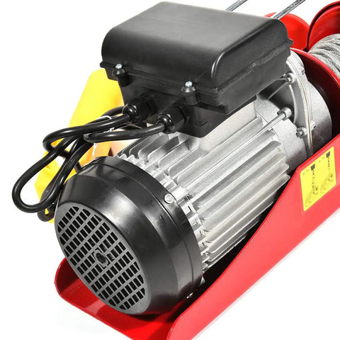 Close-up of a Built Tough 1500 Lb Overhead Electric Hoist Lift Crane for Garage Engine Work showing motor and red housing.