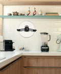 Traceless Wall Mounted Pot Lid Rack Organizer in kitchen, durable PP plastic, no drill installation, strong load bearing, black, saves space