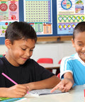 Killer Grade Two Math Anchor Charts Set Pack Includes Ten Slick Twelve By Eighteen Inch Wall Posters Paired With A No Brainer Twenty Five Page Review Guide Built For Busy Educators And Homeschool Parents Today. Two boys using math charts and workbook.