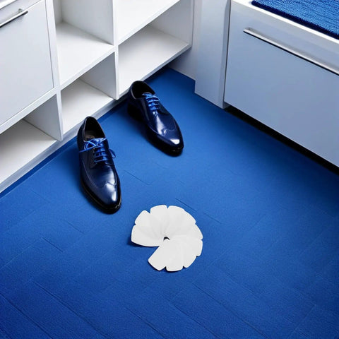 White Self Adhesive Sneaker Repair Patches For Fresh Kicks Instant Heel Hole Fix arranged near shiny blue dress shoes on a blue floor.
